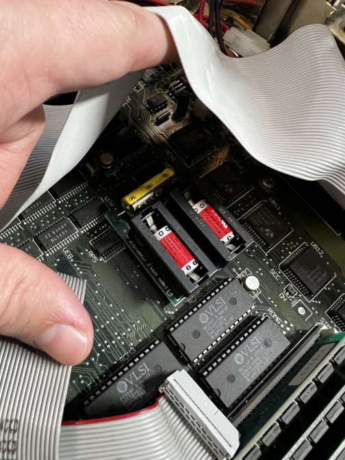 2 Maxell batteries inside of a Mac II. The top on is beginning to leak! 2 maxell batteries inside of a Mac II